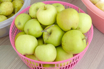 ripe yellow apples in a basket,all natural hormone-free apples,