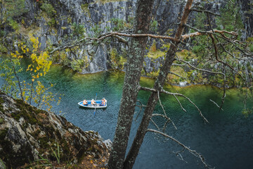 Pleasure boat in Marble canyon in the mountain park of Ruskeala, Karelia, Russia