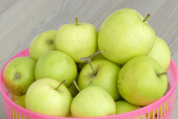 ripe yellow apples in a basket,all natural hormone-free apples,