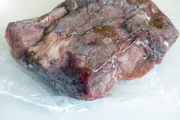 frozen beef fresh out of freezer, frozen meat,