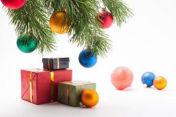 Christmas and New Year theme. Gifts and presents in a festive package under the Christmas tree