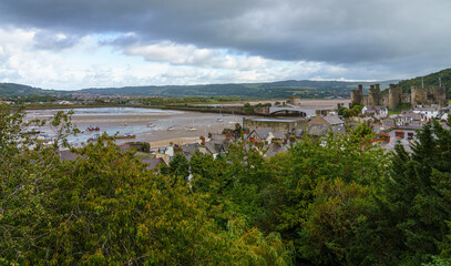 Fototapeta na wymiar view to the well preserved and imposing fortress of the 13th century medieval Conwy castle and estuary, seen from the Western town wall
