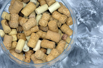 Natural cork of different companies and manufacturers from wine top view. Micro corks for wine and champagne.