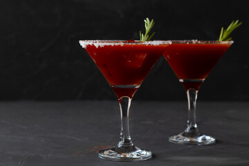 Bloody Mary cocktail. Alcoholic drink with vodka and tomato juice in a glass isolated on a black background. vampiro cocktail with pepper on table. copy space.