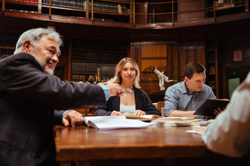 The senior professor gives a lecture to the students