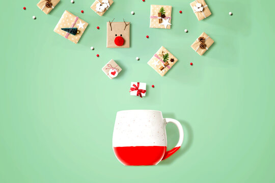Christmas gift boxes with a red mug - overhead view flat lay
