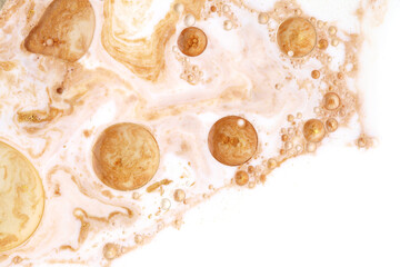 Macro Gold bubble drops in oil. Abstract flow color blots horizontal background.