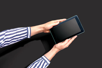 Woman using a tablet computer from above