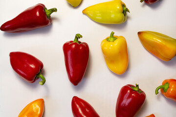 Background with colored peppers on a white background
