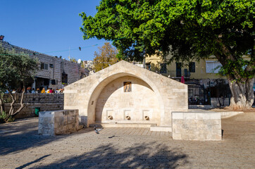Mary's Well in Nazareth surrounded by pigeons. Nazareth, Israel.