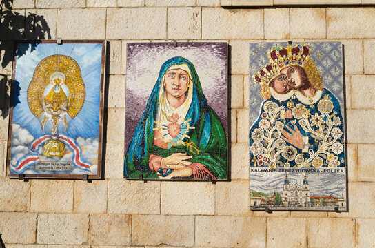 Different icon mosaics of Madonna and the Child in different cultural styles on the wall of the Basilica of Annunciation in Nazareth, Israel.
