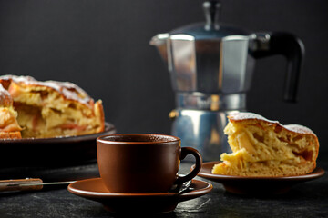 A cup of coffee with homemade apple pie