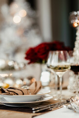 White flowers on a table with porcelain tableware