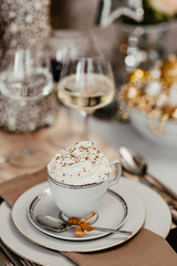 White flowers on a table with porcelain tableware