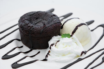 Chocolate coulant with cream and vanilla ice cream.