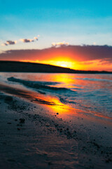 Fototapeta na wymiar Stunning Colorful Sunset On Ocean Shore