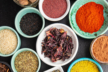 mix spices seasoning different types pungent and spicy fresh herbs, ground spice on the table copy space food background rustic 