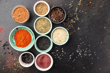 mix spices seasoning different types pungent and spicy fresh herbs, ground spice on the table copy space food background rustic 