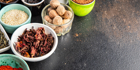 mix spices seasoning different types pungent and spicy fresh herbs, ground spice on the table copy space food background rustic 