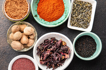 mix spices seasoning different types pungent and spicy fresh herbs, ground spice on the table copy space food background rustic 