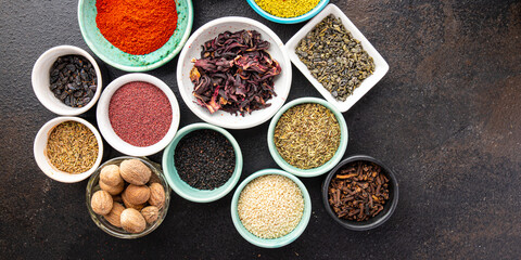 mix spices seasoning different types pungent and spicy fresh herbs, ground spice on the table copy space food background rustic 