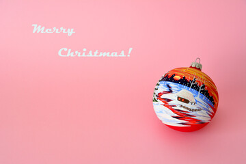 christmas card with christmas ball on pink background, place for inscription