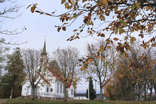 autumn leaves on the background of the wooden church - Heggedal