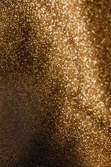 Fototapeta na wymiar Golden glitter background with small particles