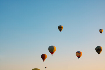 Hot air balloons on the sky in the morning. Magical view with hot air balloons.