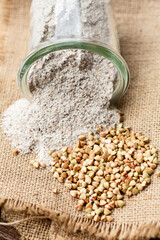ground buckwheat and seeds in a glass jar