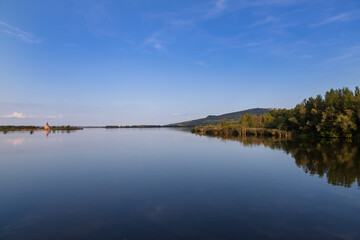 Nove mlyny reservoir and in the background the flooded church of St. Linhart and Palava with the...