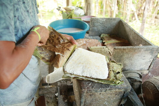 conde, bahia, brazil - october 8, 2021: preparation of tapica beiju with coconut in the rural area of ​​the municipality of Conde, north coast of Bahia.