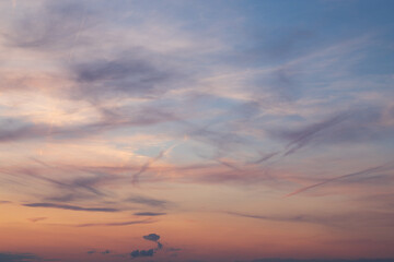 Fototapeta na wymiar Beautiful colorful sunset sky. The sun behind the colored clouds.