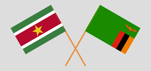 Crossed flags of Suriname and the Republic of Zambia. Official colors. Correct proportion