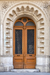 Paris, an ancient door, typical building in the 11e arrondissement
