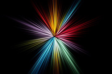 Abstract surface of blur radial zoom in blue, pink and yellow tones on a black background. Abstract multicolored background with radial, diverging, converging lines in the shape of a star.