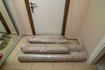Rolled carpets for after washing. Clean carpets in front of the door. Carpet cleaning concept