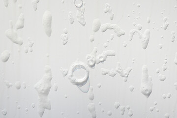 soapy bubble pattern on white fiberglass wall