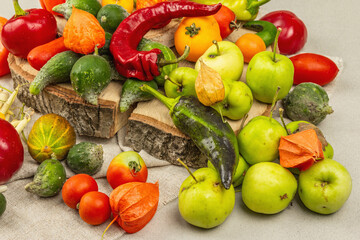 Trendy ugly organic vegetables and fruits on stone concrete background