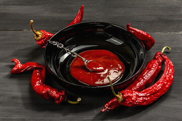 Ripe hot chili pepper on wooden boards background