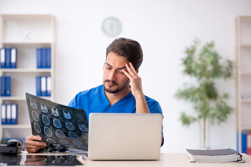 Young male doctor radiologist working in the clinic