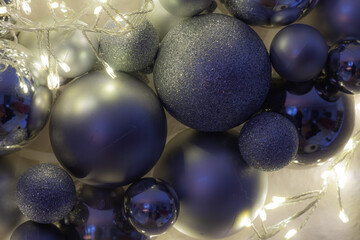 details of an illuminated advent wreath with shiny Christmas baubles