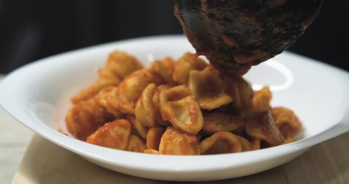 The first course of orecchiette with sauce, a typical Apulian dish. Typical Italian cuisine