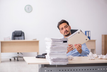 Young male employee rejecting new ideas in the office