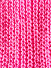 pink knitted background. pigtail texture
