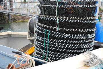 Crab and shrimp netted pots on a fishing boat.