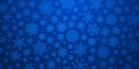 Christmas background of big and small complex snowflakes in blue colors