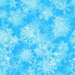 Christmas seamless pattern of big complex snowflakes in light blue colors. Winter background with falling snow