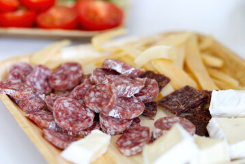 Antipasto catering platter with jerky, salami and cheese. close up
