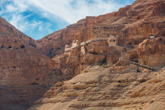 The Monastery of the Temptation on the red rocks. The Mount of Temptation in Jericho, Palestine. Greek Orthodox monastery. Judean desert